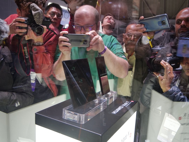 Journalists and photographers take pictures of the first foldable 5G phone from Huawei during Mobile World Congress in Barcelona.