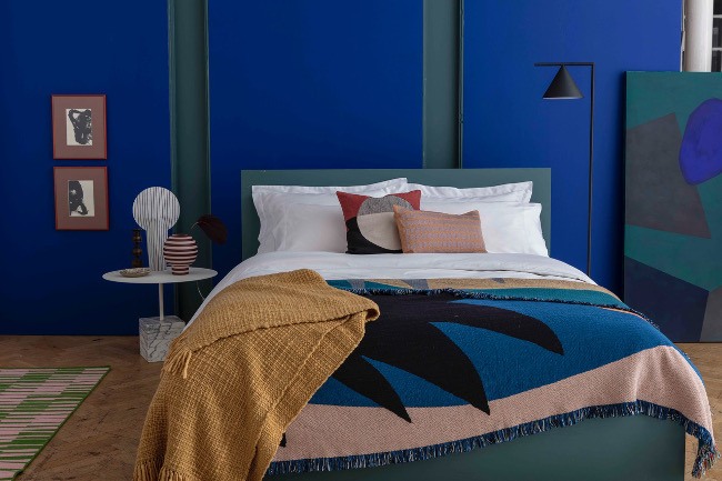 Picture of the bedding products on a bed from Rise & Fall.