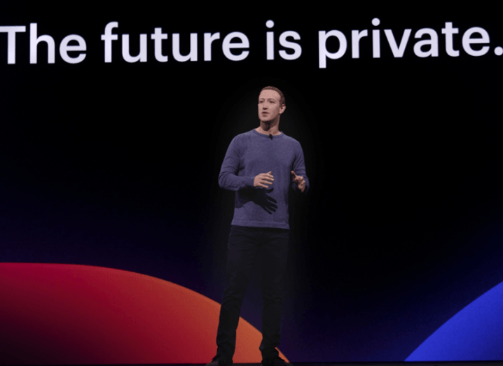 Mark Zuckerberg on stage with the words The Future is Private on a screen behind him.