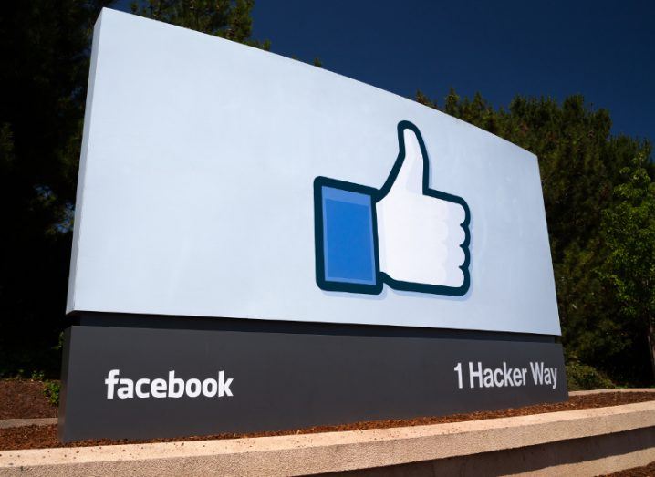 View of sign for 1 hacker Way, facebook corporate headquarters in Silicon Valley, with arid dirt below.