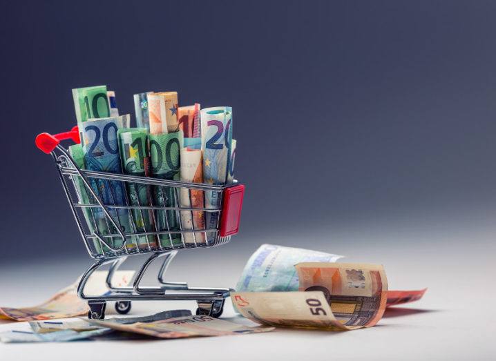 Shopping trolley full of euro notes.