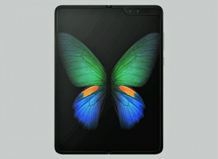 The Samsung Galaxy Fold displaying a photograph of a butterfly on its screen.