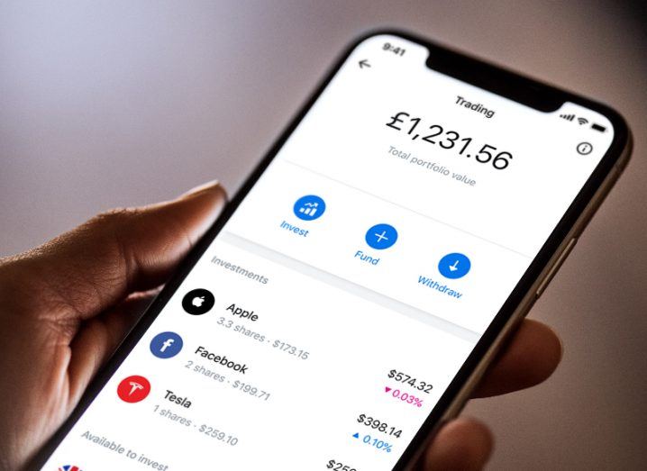 View of Revolut app interface with commission-free stock trading product displayed on smartphone.
