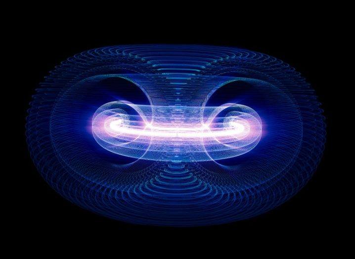 Concept image of particles moving through a doughnut-shaped Tokamak nuclear fusion reactor coloured blue.