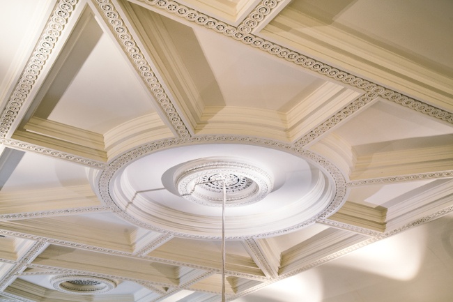 A decorative, old-fashioned white ceiling