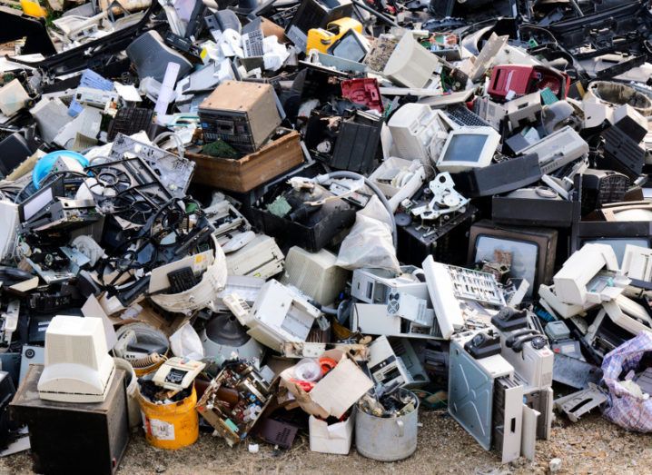 A large pile of e-waste including computers, monitors, TV sets, games consoles and telephones.