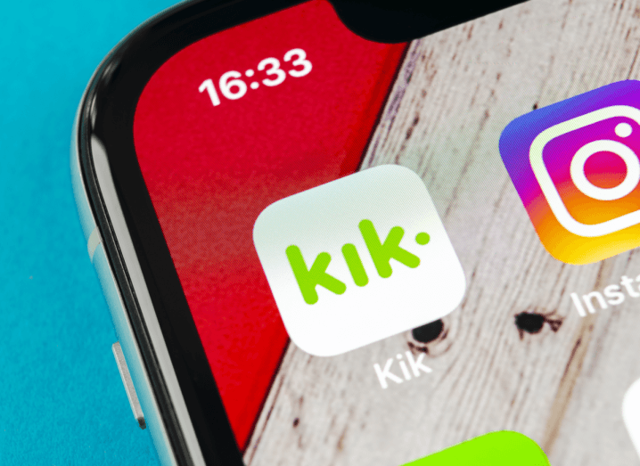 An iPhone XR screen displaying the Kik icon beside the Instagram icon.