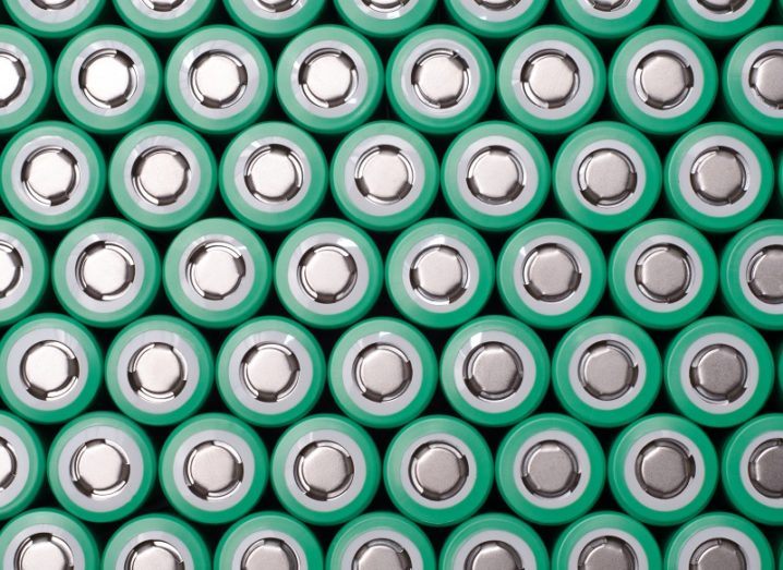 Stacks of green lithium-ion batteries.
