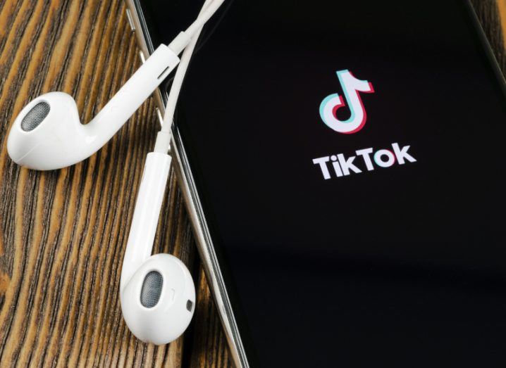 Close-up of Tik Tok application icon on Apple iPhone screen.