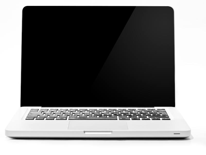 A white Apple macbook sitting against a white background.