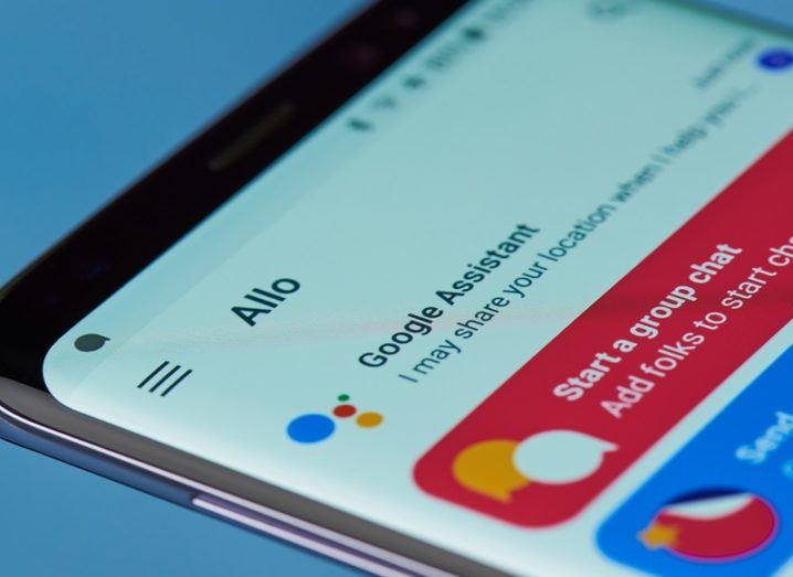Close-up of a smartphone with Google Assistant open.