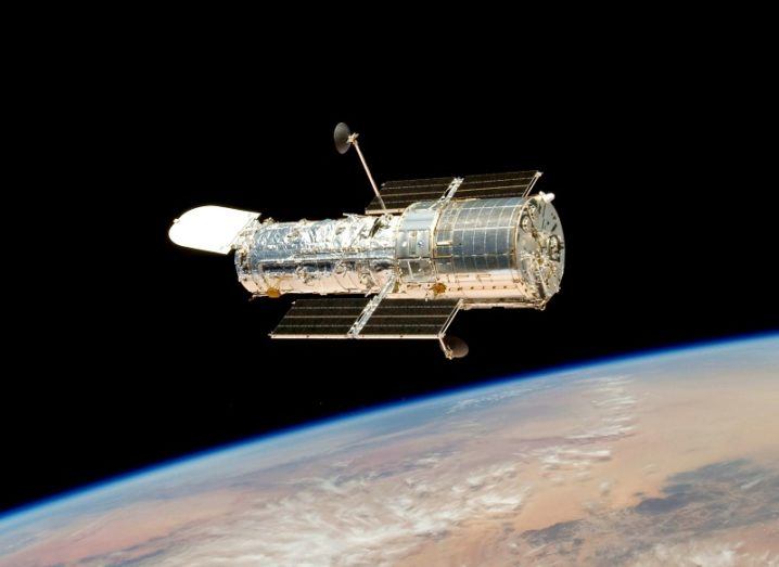 The Hubble Space Telescope in orbit above Earth.