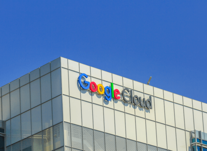 A grey building in front of a blue sky, with Google Cloud emblazoned on the outside.
