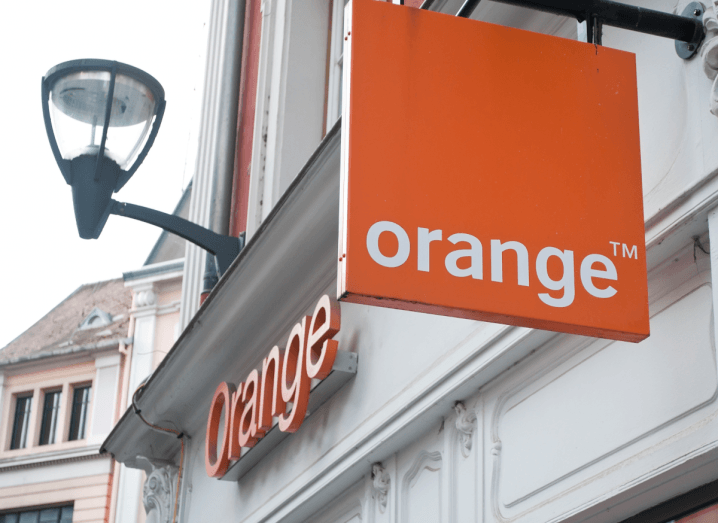 The Orange logo on an ornate white building.