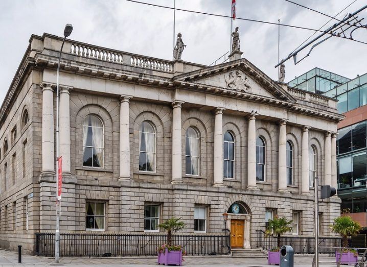 The RCSI building in Dublin city centre against a grey sky background.