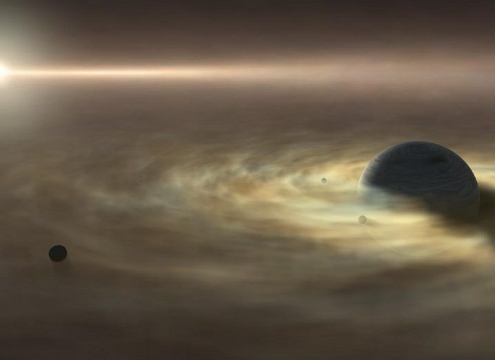 Artist’s impression of a satellite forming around a giant gas planet which is itself still forming around a star.