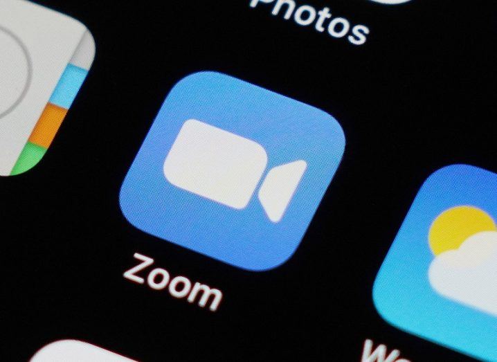 The Zoom app logo on a phone screen.