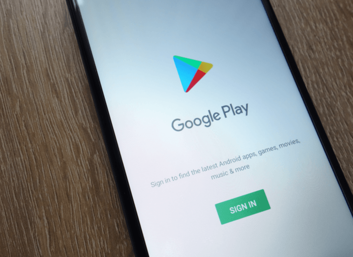 The Google Play logo displayed on the screen of a phone.