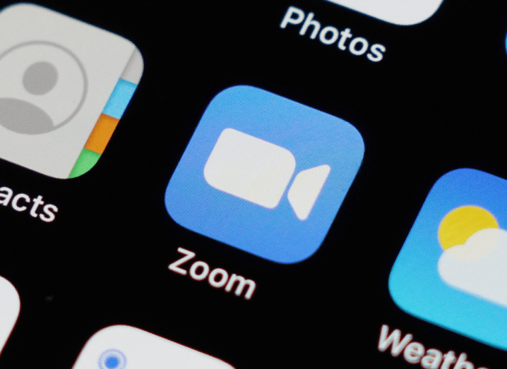 The Zoom logo displayed on an iPhone screen.