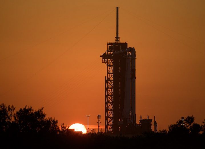 Sunrise behind the Demo-2 mission waiting on the launch pad.