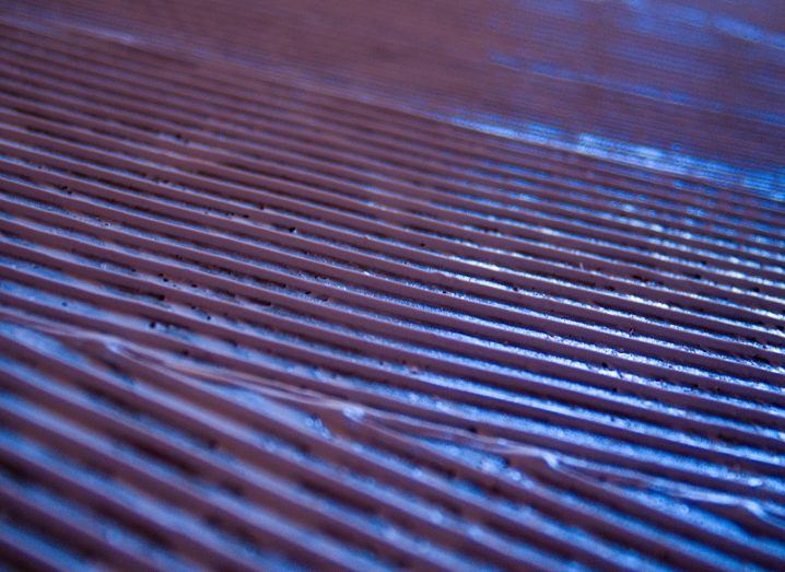 Metal sheets with grooves coloured blue.