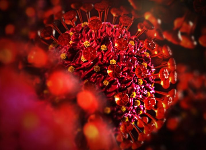 3D illustration of the coronavirus coloured red.