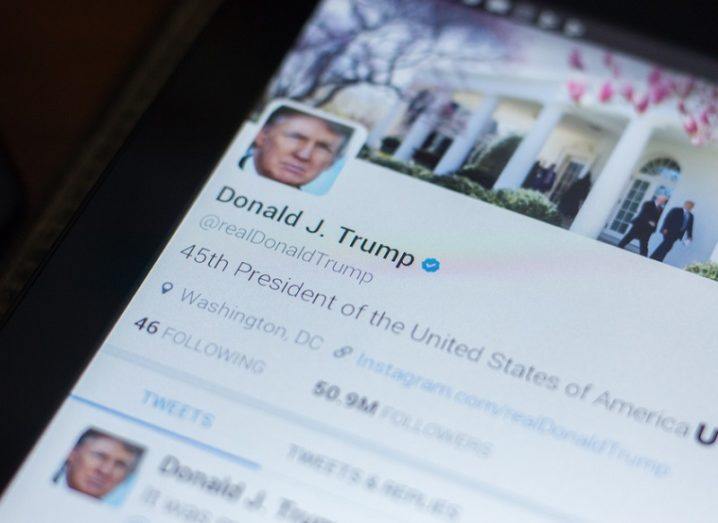 Twitter profile of Donald Trump on a smartphone.