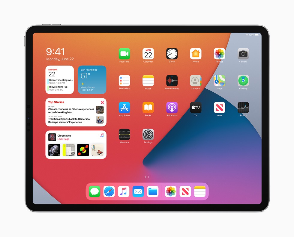 A photograph of an iPad displaying the latest version of iPadOS, which includes widgets.