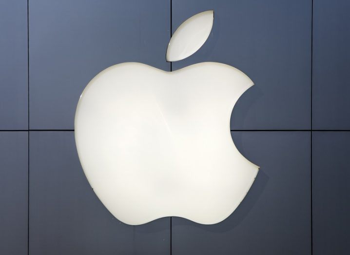 The Apple logo on a shop wall.