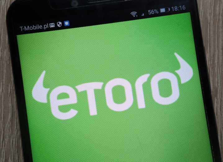 The eToro logo displayed on a smartphone screen.