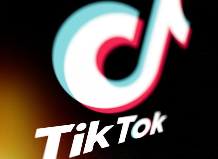 Close-up of the TikTok logo on a black background.