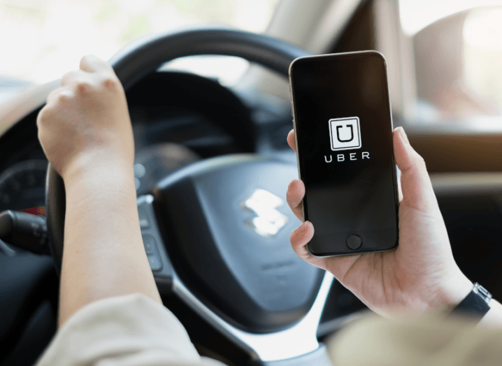 The Uber logo displayed on a smartphone screen.