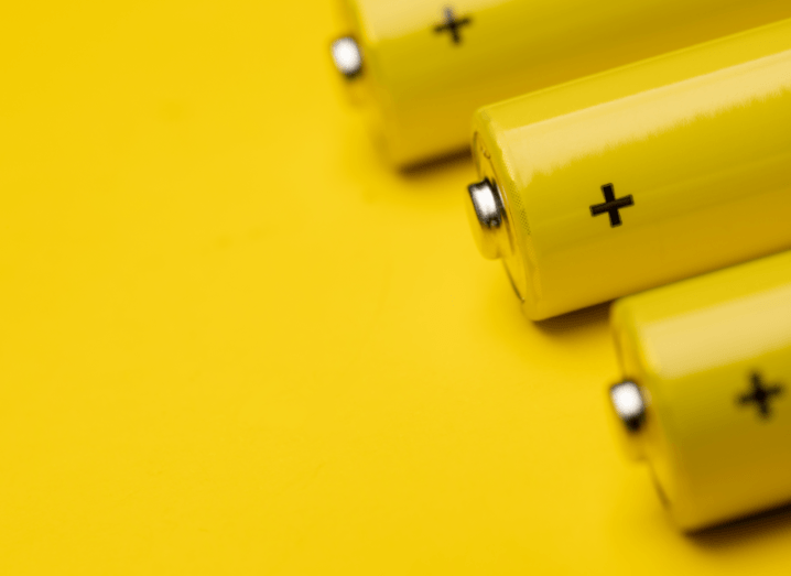 Yellow batteries in front of a yellow background.
