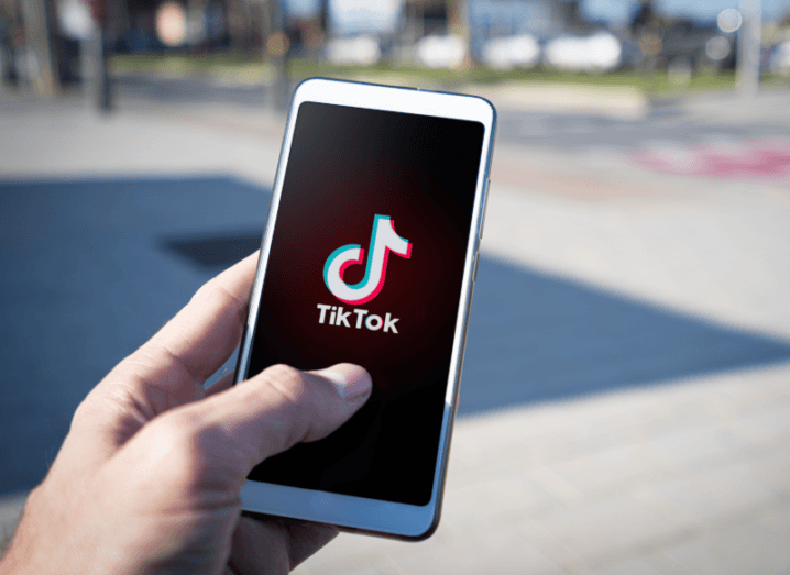 The TikTok logo displayed on the screen of a smartphone.