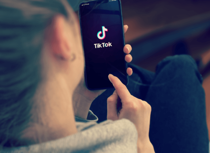 A person using the TikTok app on their phone.