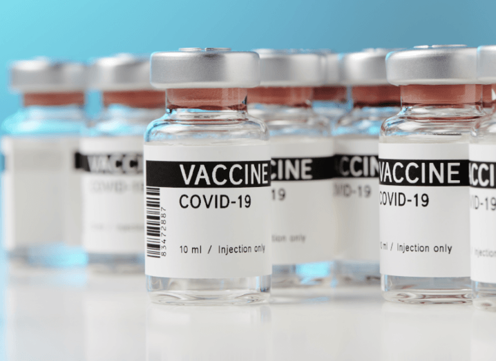 Small bottles labelled with ‘Covid-19 Vaccine’ to represent the concept of a vaccine.