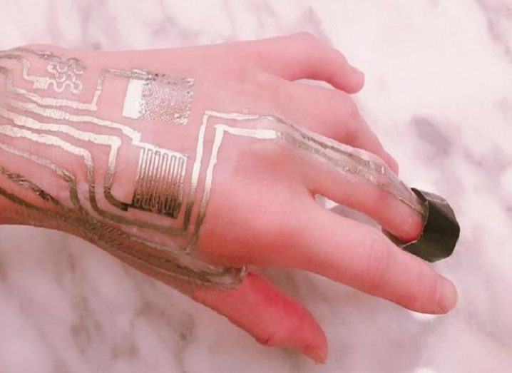 The sensor circuitry printed on a human hand.