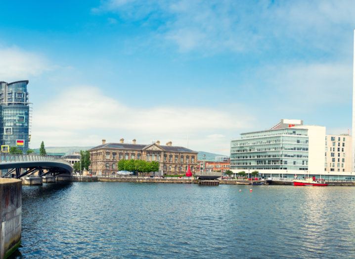 Panoramic view of the river Lagan in Belfast city, with office blocks overlooking the water.