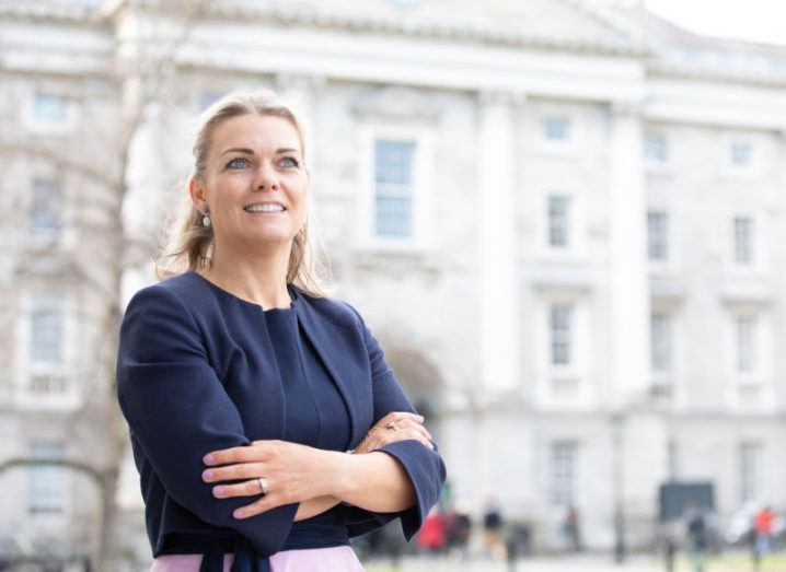 Nessa McEniff of Learnovate stands in the front square of Trinity College Dublin.