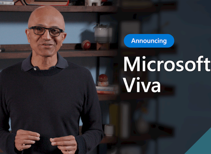 Microsoft CEO Satya Nadella stands in an office. Beside him his text that says 'Introducing Microsoft Viva'.