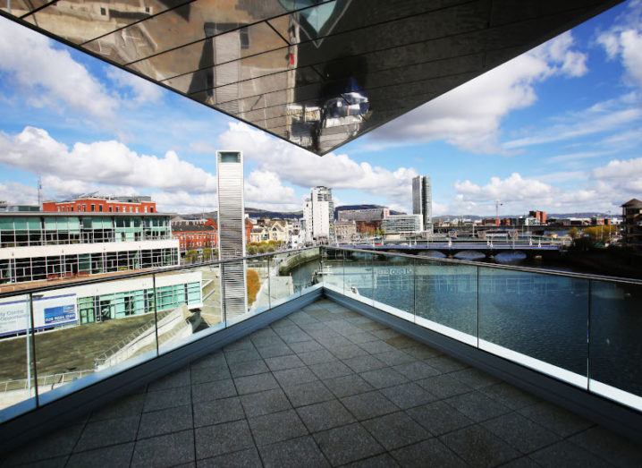 A shot of Belfast City from a modern balcony on a sunny day, where the MIT tech conference will take place.