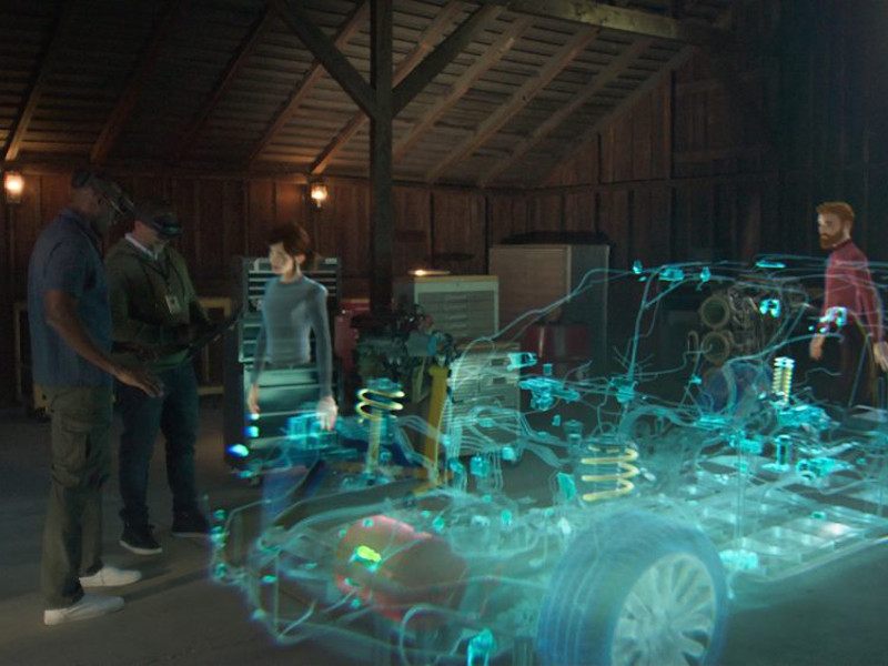 A virtual image of people gathered together around a vehicle.