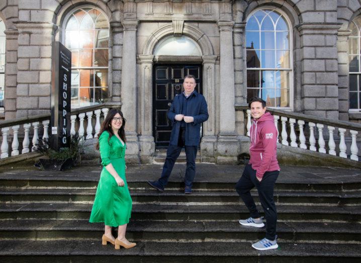 Three people stand socially distanced on the steps of the Powerscourt Centre in Dublin city.