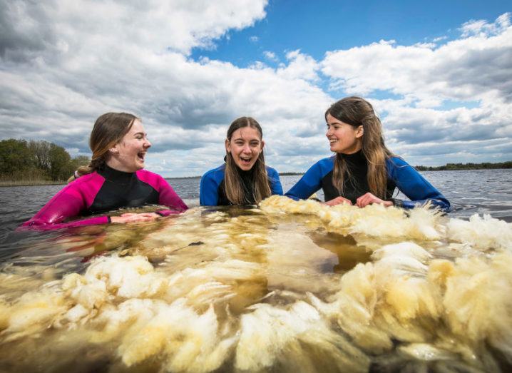 Three young girls wearing wet suits in the sea surrounded by a large wad of wool. They were overall group winners in last year’s BT Young Scientist awards.