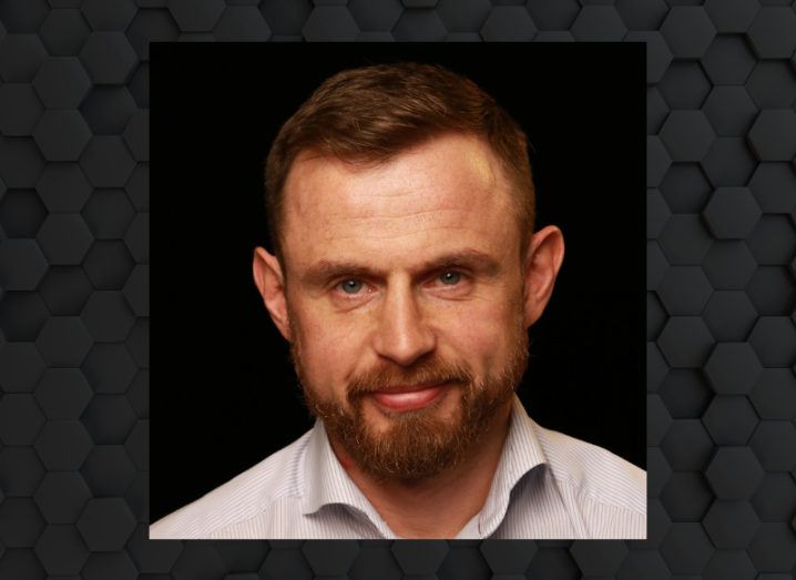 A headshot of Mark Finlay of Amazon Web Services against a black background.