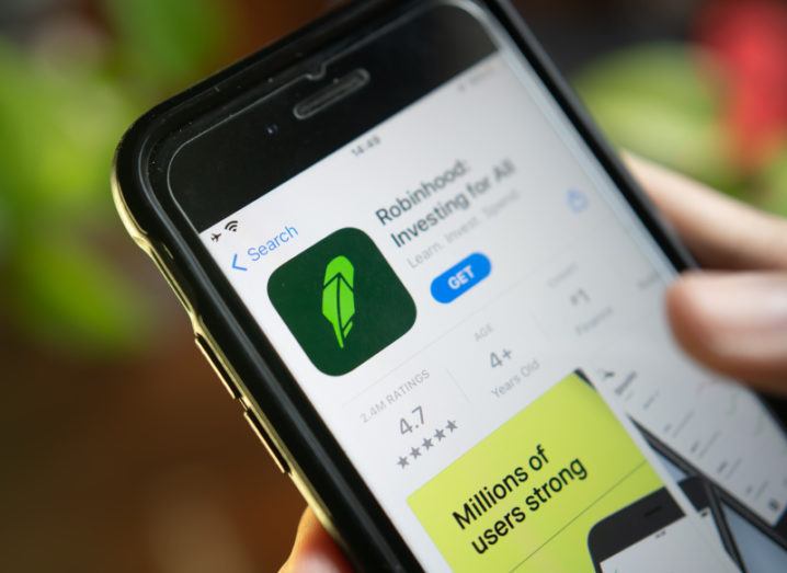 An app store is open on a phone, with details about the Robinhood app on the screen.
