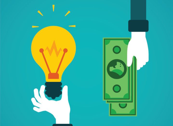 Illustration of a hand holding a lightbulb, representing a start-up idea, and another offering money to invest.