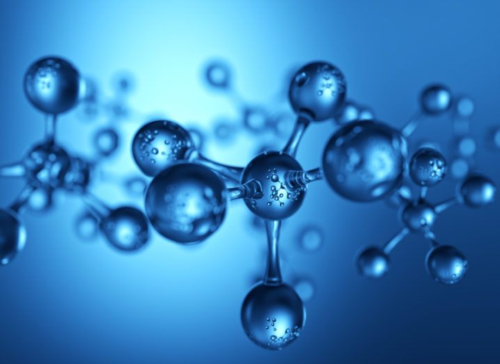 Blue molecules are depicted in the image. The central sphere of the molecule is bonded to five other individual atoms, which all resemble glass.