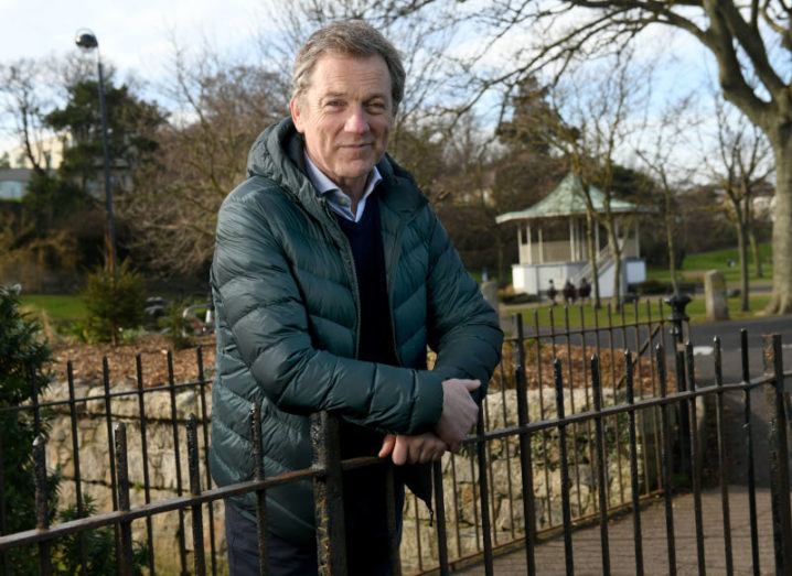 Photo of Niall O'Grady leaning on railings in a park.