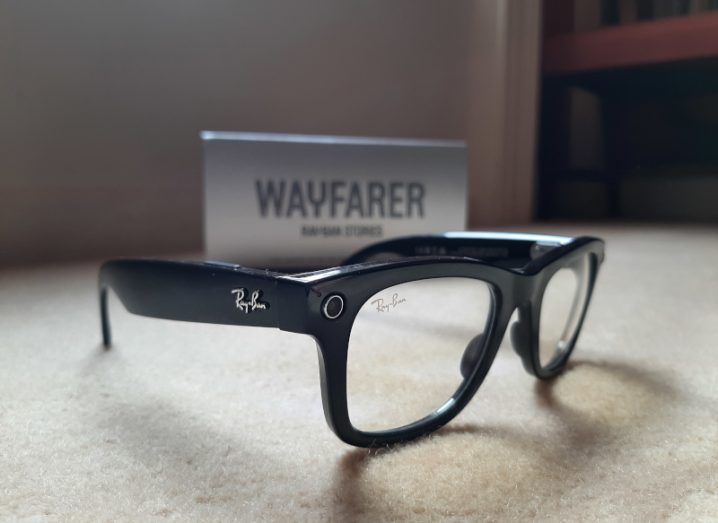 A close up of the Ray-Ban stories, in the Wayfarer style with black frames and clear lenses.